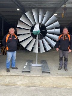Russel and Lester of AMR Pumps with a windmill